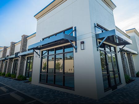 Installed Metal Sunshade Custom Product by Valentines Glass & Metal (VGM) at New Construction Project